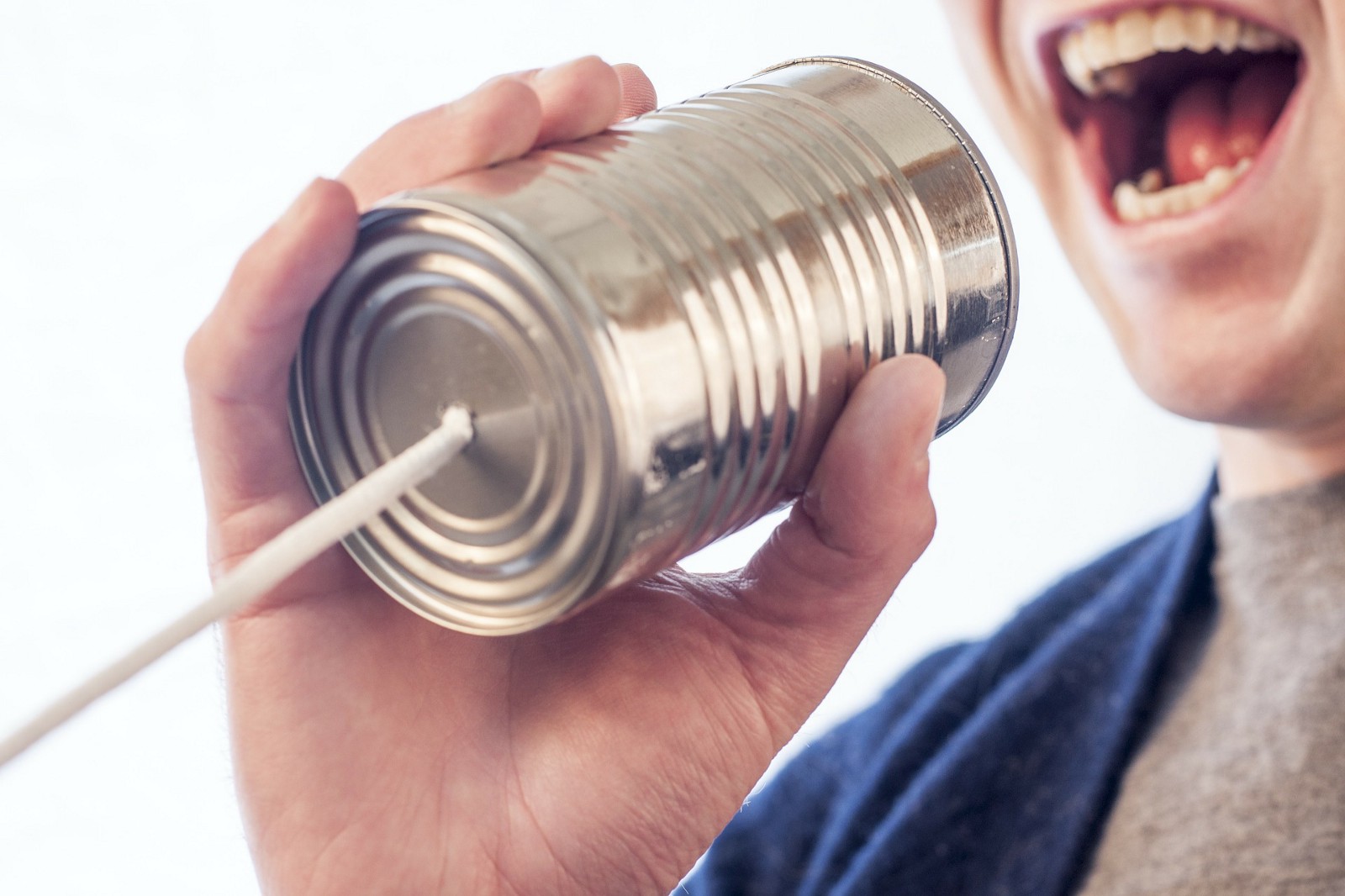 man speaking into metal can phone line, communication, public speaking, crosslead, washington dc